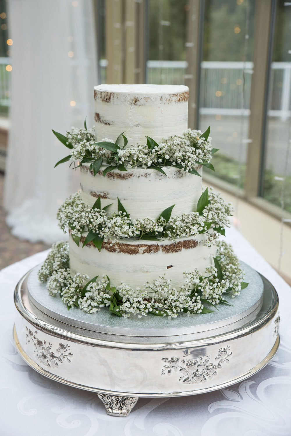 cake-8 Three tier wedding cake with custom thymus serpyllum white design